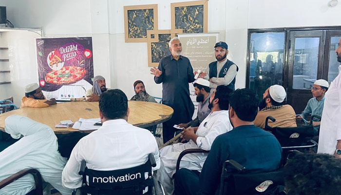 Paraplegic Centre Peshawar CEO Dr Syed Muhammad Ilyas speaks with the disabled persons at Paraplegic Centre Peshawar on June 9, 2025. — Facebook@paraplegiccenterpeshawar