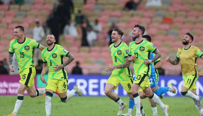 Australias players celebrate reaching the World Cup. —AFP/File