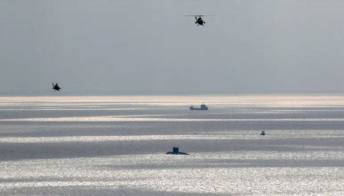 Helicopters fly during an annual drill in the coastal area of the Gulf of Oman and near the Strait of Hormuz, Iran. —Reuters/File