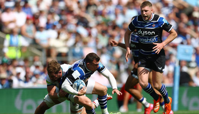 Leicester Tigers Olly Cracknell in action with Bath Rugbys Ben Spencer, June 14, 2025. —Reuters