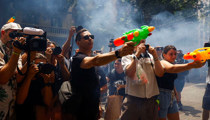 Demonstrators use water pistols during a protest against mass tourism, in Barcelona, Spain June 15, 2025.—Reuters