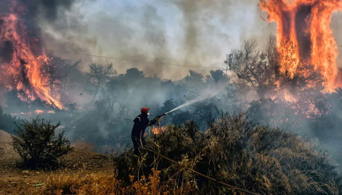 This representational picture shows a firefighter as he douses flames on a wildfire at Panorama settlement near Agioi Theodoroi, some 70km (43 miles) west of Athens. — AFP/File