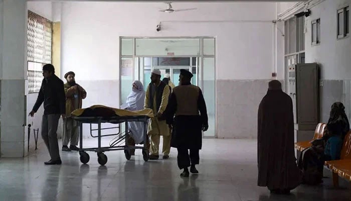 A representational image shows relatives turning to a man treated at a hospital. — AFP/File