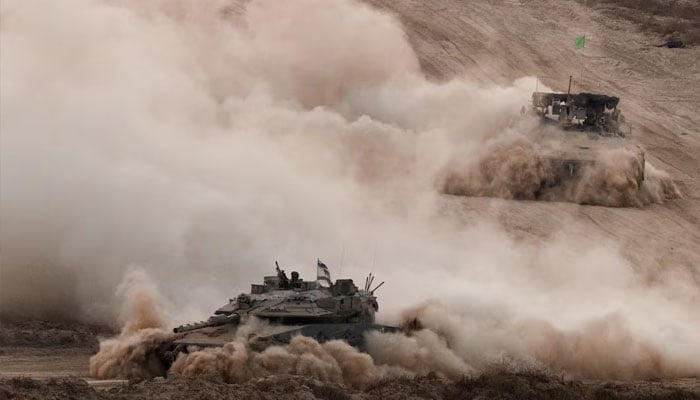 Israeli military vehicles manoeuvre in Gaza, as seen from the Israeli side of the border, June 17, 2025.—Reuters