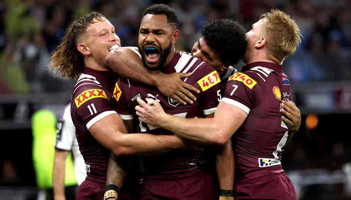 Maroons Hamiso Tabuai-Fidow celebrates a try with teammates. —AFP/File