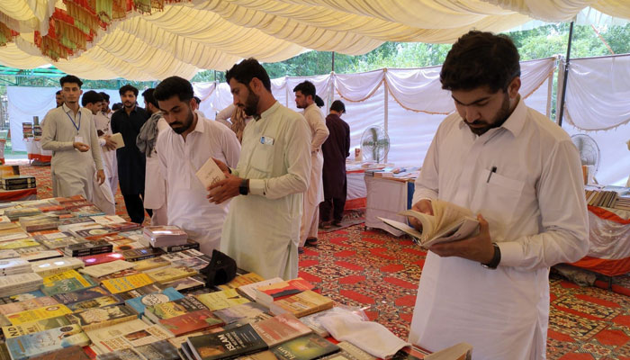 People visit bookstalls during  two-day book fair organized jointly by the Pakistan Army, district administration, and the Department of Youth Affairs on June 17, 2025. — Facebook@youthbannu