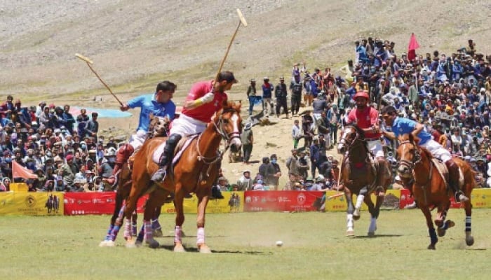 Players in action during the final match of Shandur Polo Festival between Chitral and Gilgit teams. — APP/File
