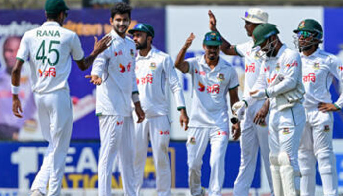 Bangladeshs Nayeem Hasan (2nd left) celebrates after taking the wicket of Sri Lankas Dhananjaya de Silva during the fourth day of the first Test cricket match between Sri Lanka and Bangladesh. — AFP