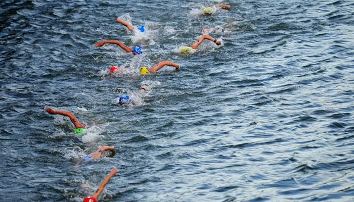Triathlon athletes swim in the Seine during the womens individual race at the Paris 2024 Olympics, July 31, 2024. — Reuters