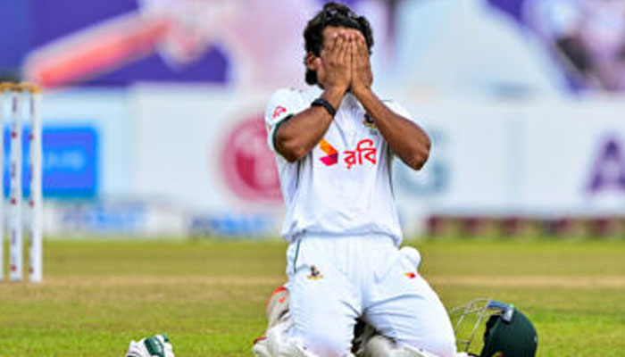 Bangladeshs captain Najmul Hossain Shanto celebrates after scoring a century during the fifth and final day of the first Test cricket match against Sri Lanka. —AFP