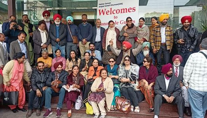 Participants pose for a group photo at the World Punjabi Congress.— APP/File