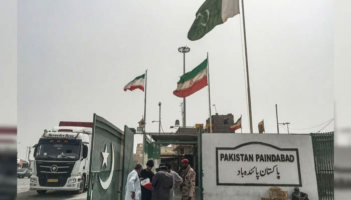 Pakistani security personnel check the documents of people who came from Iran at the Pakistan-Iran border in Taftan on June 16, 2025. — AFP
