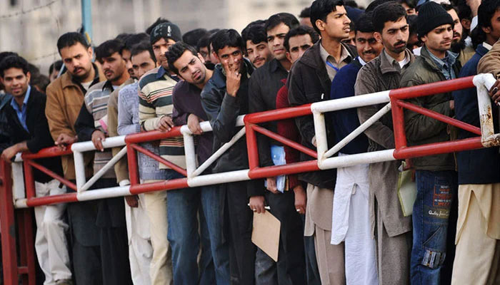 Youth wait for their turn for a Capital Development Authority (CDA) job entry test in Islamabad. — AFP/File