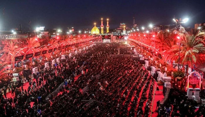 Muslim gather to attend a mourning ritual on the eve of Ashura, which commemorates the martyrdom of Prophet Mohammeds (PBUH) grandson Imam Hussein (RA), at the shrine of Imam Abu Al-Fadl al-Abbas in Iraqs central holy city of Karbala on July 15, 2024. &mdash; AFP