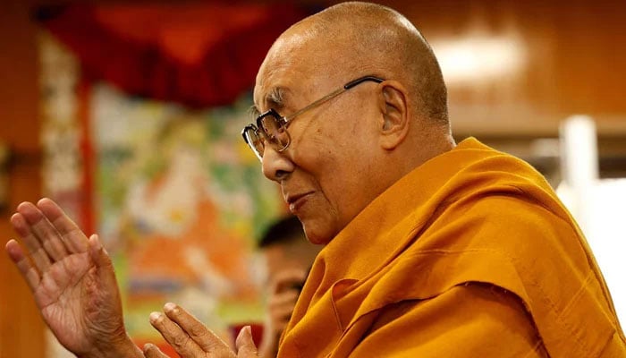 Tibetan spiritual leader, the Dalai Lama, offers blessings to his followers at his Himalayan residence in the northern hill town of Dharamshala, India, December 20, 2024. &mdash; Reuters