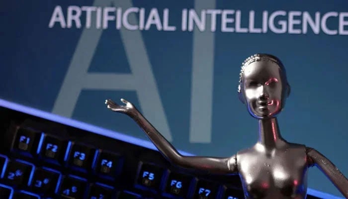 A illustration showing a robotic figure against the backdrop of AI written in the background on May 4, 2023. &mdash; Reuters