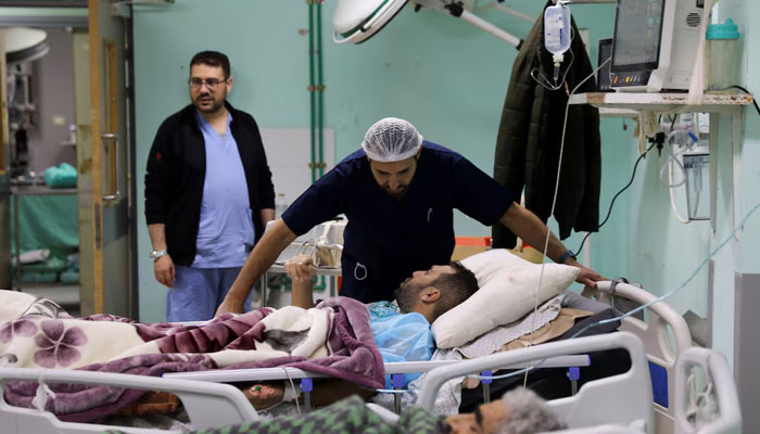 Palestinian-Irish plastic surgeon Ahmed El Mokhallalati checks a Palestinian man wounded in an Israeli strike, at the European Hospital, in Khan Younis in the southern Gaza Strip January 31, 2024. — Reuters