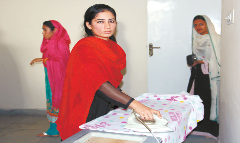 Girls being trained in various household chores