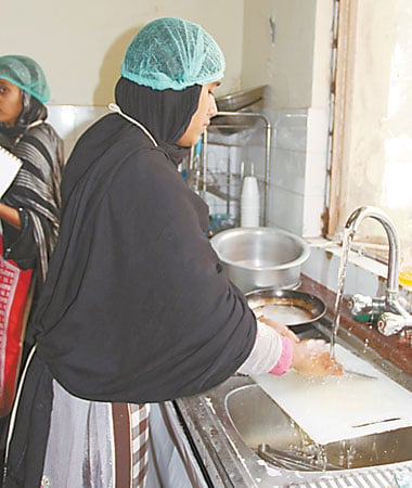 Girls being trained in various household chores