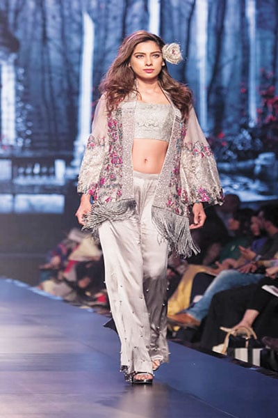 Model Nooray Bhatti sashays down the BCW ramp in a fringed, steel grey and pink number from Mirza&rsquo;s Roses in the Rain.