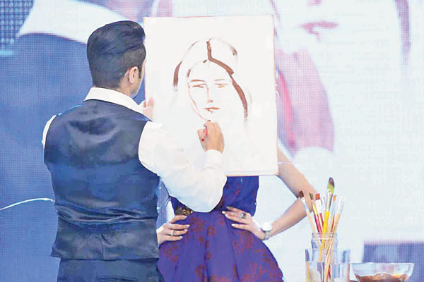 Ali Zafar swapped his guitar for a paintbrush as he dipped it in chocolate and painted man as a two-faced creature.