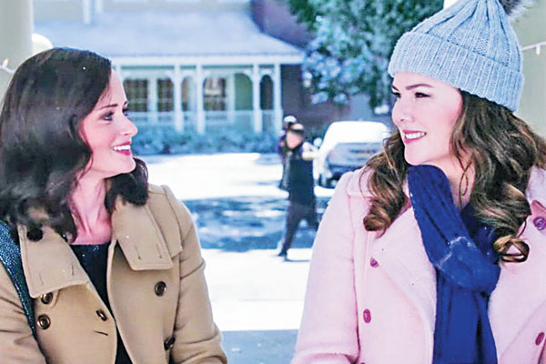 Lorelai and Rory sitting in the gazebo sipping on coffee.