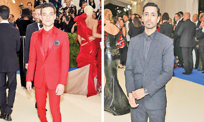 Actor and rapper Riz Ahmed wore an all-black, sheenladen tuxedo from Dior Homme while Mr. Robot star Rami Malek opted for a bold red Dior Homme suit.