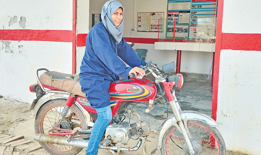 Aqsa, first Milk Collection Agent, on her way to work