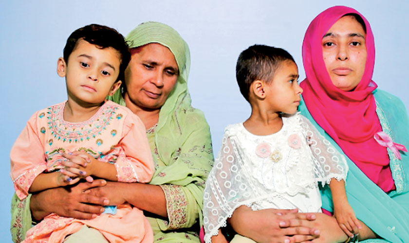 Saba, a cancer survivor from Narowal, with her mother and two daughters.