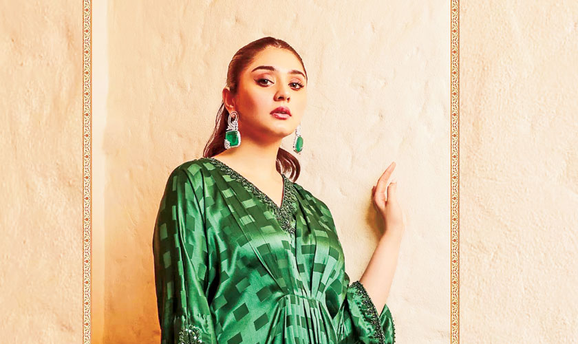 This sumptuous deep emerald green kaftan is undoubtedly our number one choice for your Eid outfit ideas. Detailing on the neckline and sleeves are added to elevate the whole look. Pair it with matching statement emerald earrings and a sleek updo. A perfect dress for evening gatherings.