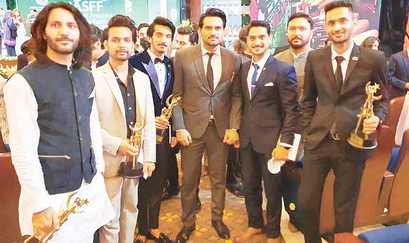 Actor/producer Humayun Saeed with the excited winners.