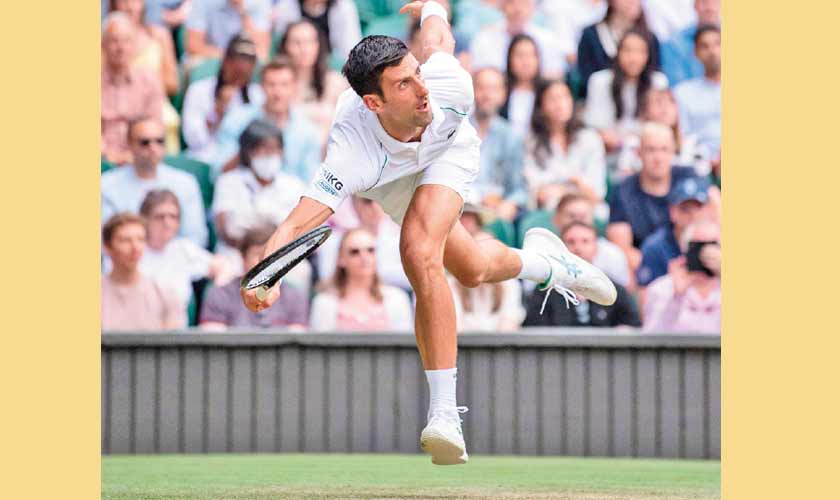 Serbia’s Novak Djokovic returns against Hungary’s Marton Fucsovics during their men’s quarter-finals