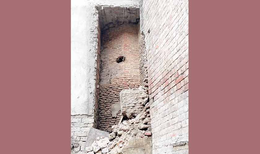 The octagonal tower in ancient bricks, encroached by modern bricks. — Image: Supplied