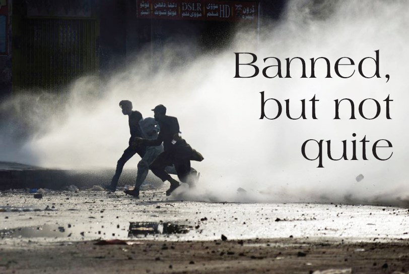 Supporters of the banned Tehreek-e-Labaik Pakistan (TLP) run to cover amid water jet during a protest against the arrest of their leader in Lahore. REUTERS