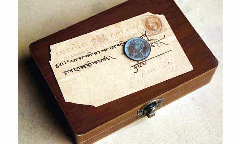 The EIC postcard pictured with a quarter anna from 1880.