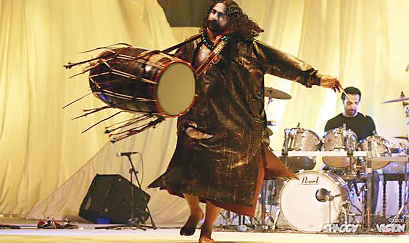 Pappu Saeen playing his dhol during an Overload set, seen here with the Farhad Humayun, on drums.