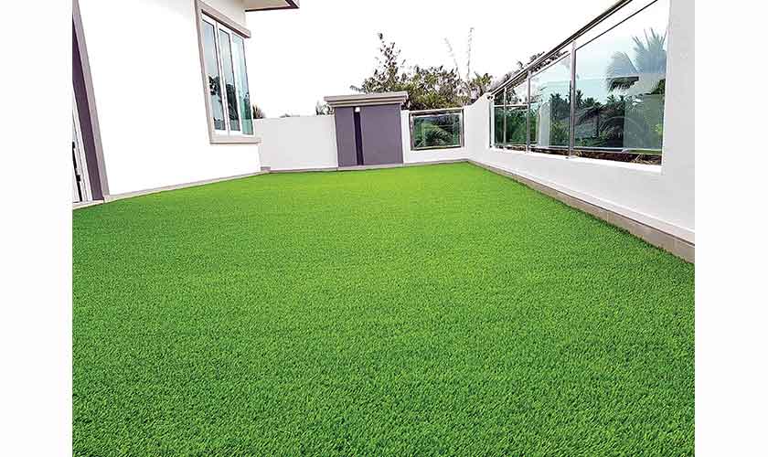 Artificial grass is already a trend in posh localities. It does not need to be watered and would still give you a green roof.