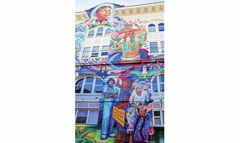 A five-story mural, MaestraPeace, wraps around the Women’s Building.