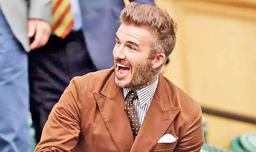 Always well-groomed and erring on the side of fashionable, David Beckham cuts a dashing figure in a strong sienna jacket, and his trademark dirty-blonde hair.