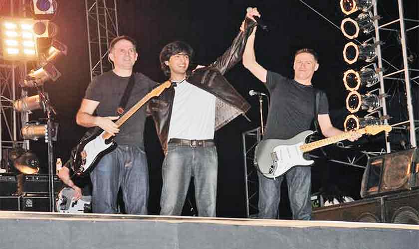 Shehzad Roy and Bryan Adams onstage during a concert in Karachi.