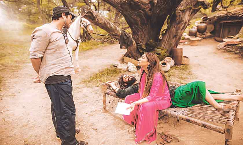Bilal Lashari with Mahira Khan and Fawad Khan during the shooting of the smash hit, The Legend of Maula Jatt. Fawad Khan features in the titular role of Maula Jatt while Mahira Khan essays the role of Mukkho Jatti.