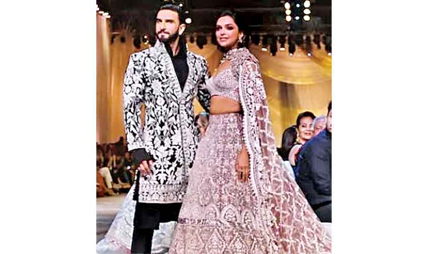 Ranveer Singh and Deepika Padukone during a Manish Malhotra fashion showcase as showstoppers as well as influencers