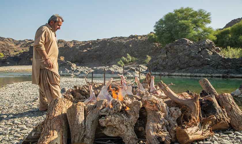 Sajji making on the riverbed near Uthal, Balochistan.