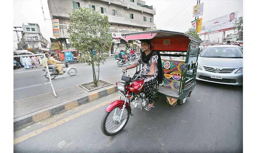 The pilot phase is set to commence in December this year, with 35 rickshaws hitting the streets of Lahore. — Photo by Rahat Dar