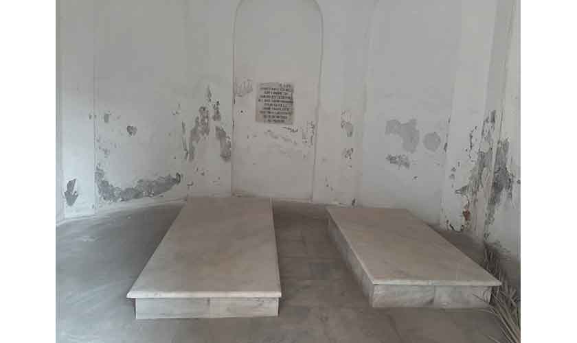 The marble plaque on the back wall has french engraved on it that. It says that these are the graves of General Allard and her daughter Marie.