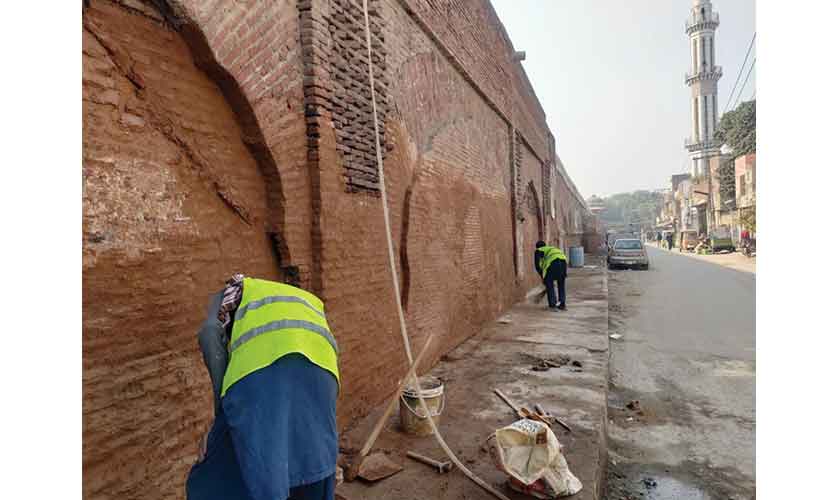 Ongoing conservation work on the outer wall of Shalimar Gardens, Lahore.