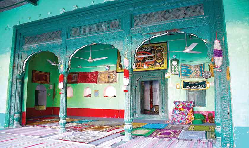 View of triple wooden arched entrances.