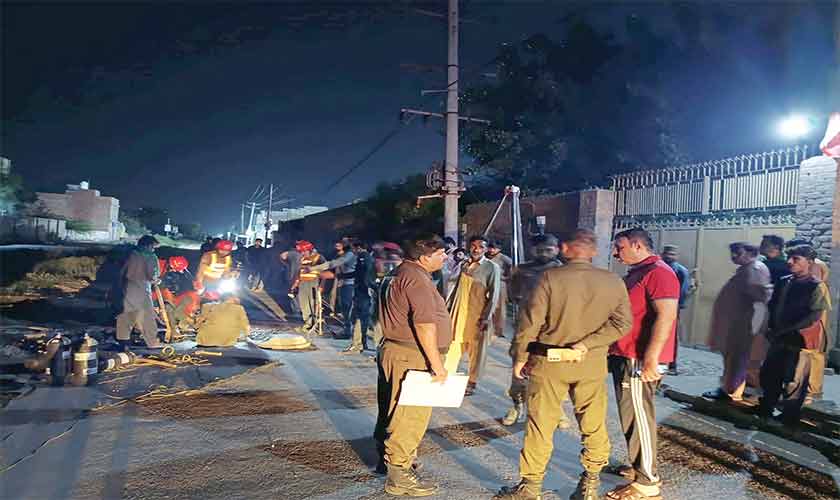 Rescue officials recovering the bodies