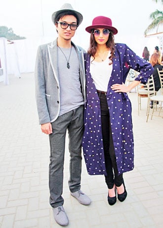 Complete style mavens and fashion creatures - blogger Batur Mehmood and model Zara Peerzada - were all about eccentric fun with Batur in a floppy hat, a charcoal grey blazer and matching toads and Zara in a trendy polka-dotted navy trench coat and a contrasting purple hat.