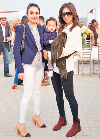 Fresh-faced beauties: Mahgul Rashid is smartly dressed with a belt cinched around the waist of a pin-striped business-like shirt with pure white jeans and nude heels with a Chanel Interlaced chain bag to go with the color palette she's opted for. Ayesha Noon, while she may not have the show-stopping chutzpah of Meesha Shafi or Zara Peerzada is definitely a fashionista to watch, getting the demure button-up collar trend spot on and relaxing the severity of it with a cropped white sweater. And we love the windblown hair look - it's a nice change from one perfect hairdo after another. 